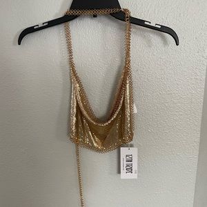 Reposhing! 12th tribe gold crop top, threading shown on one corner of the shirt.